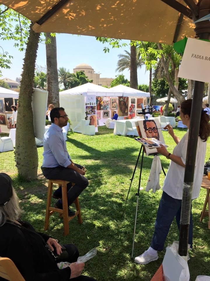 Painting a 15 minute portrait at a spring festival