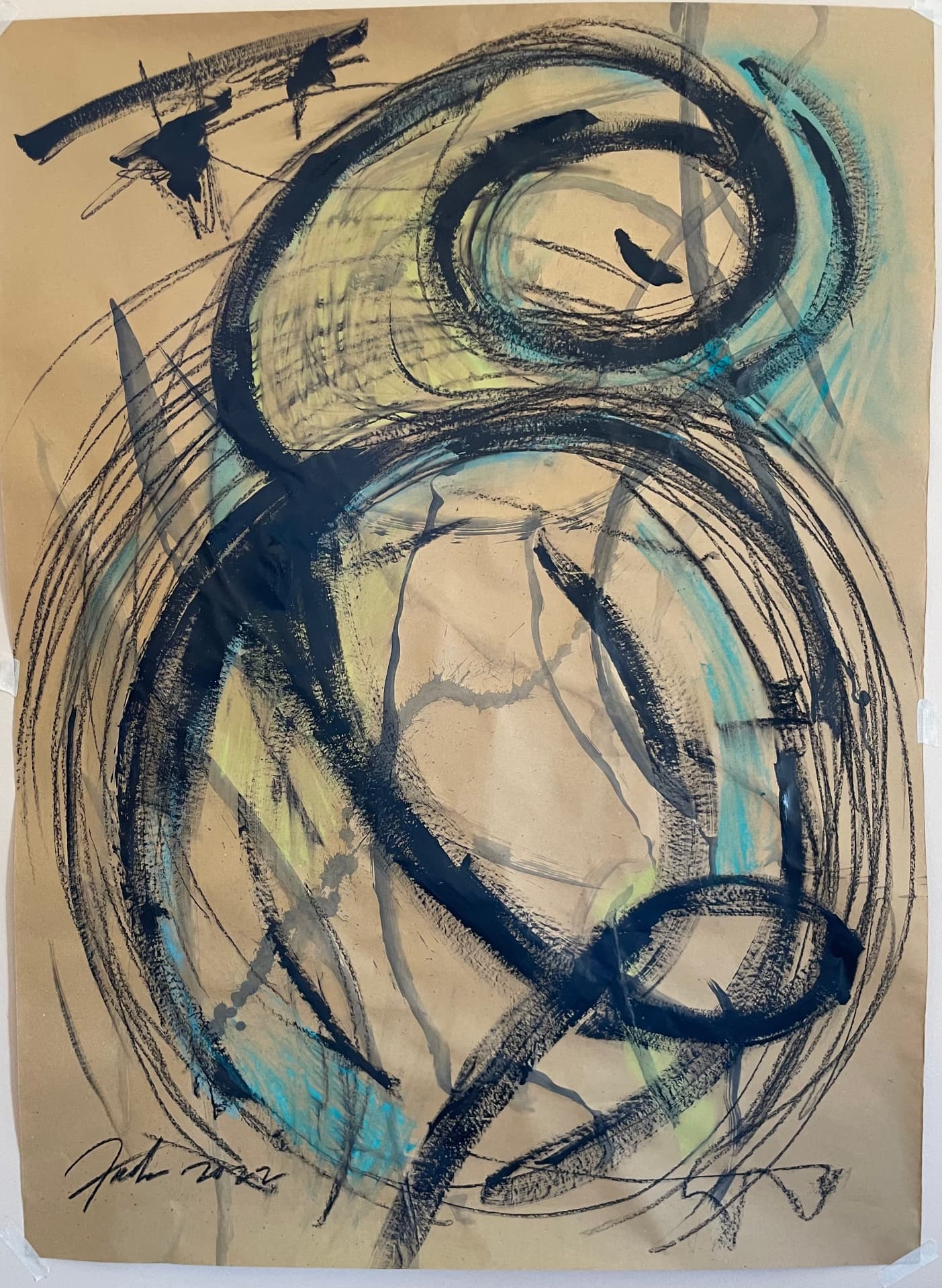 Abstract painting on kraft paper — large black circles with teal and yellow, 2022